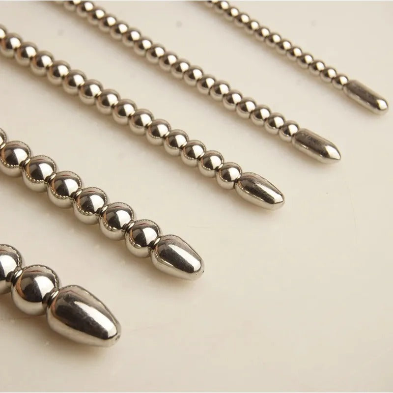 Body-safe stainless steel urethral beads with polished finish, detail shot