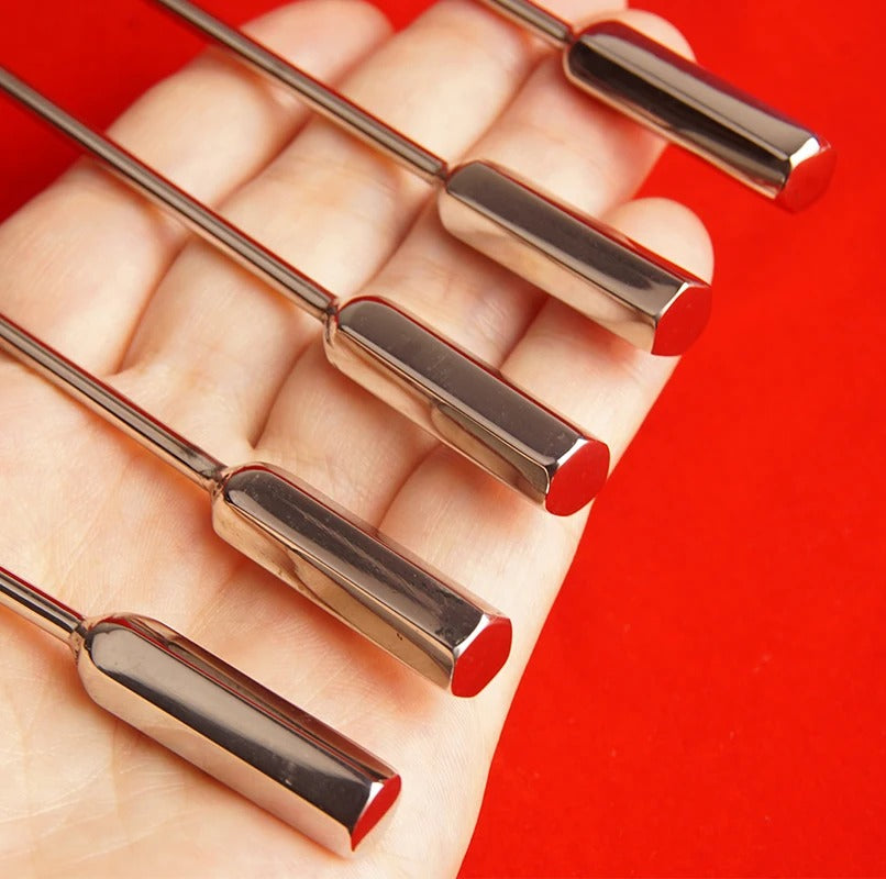 Studio photo emphasizing length of stainless steel bullet-tip urethral sound dilator for sensation play