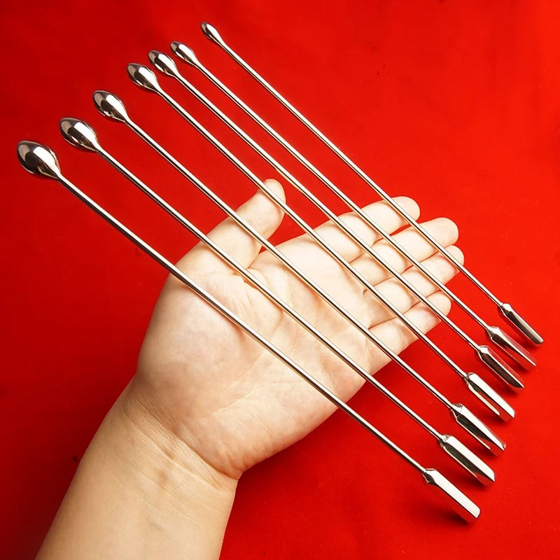 Angled front view of stainless steel bullet-tip urethral sound penis plug, polished metal finish