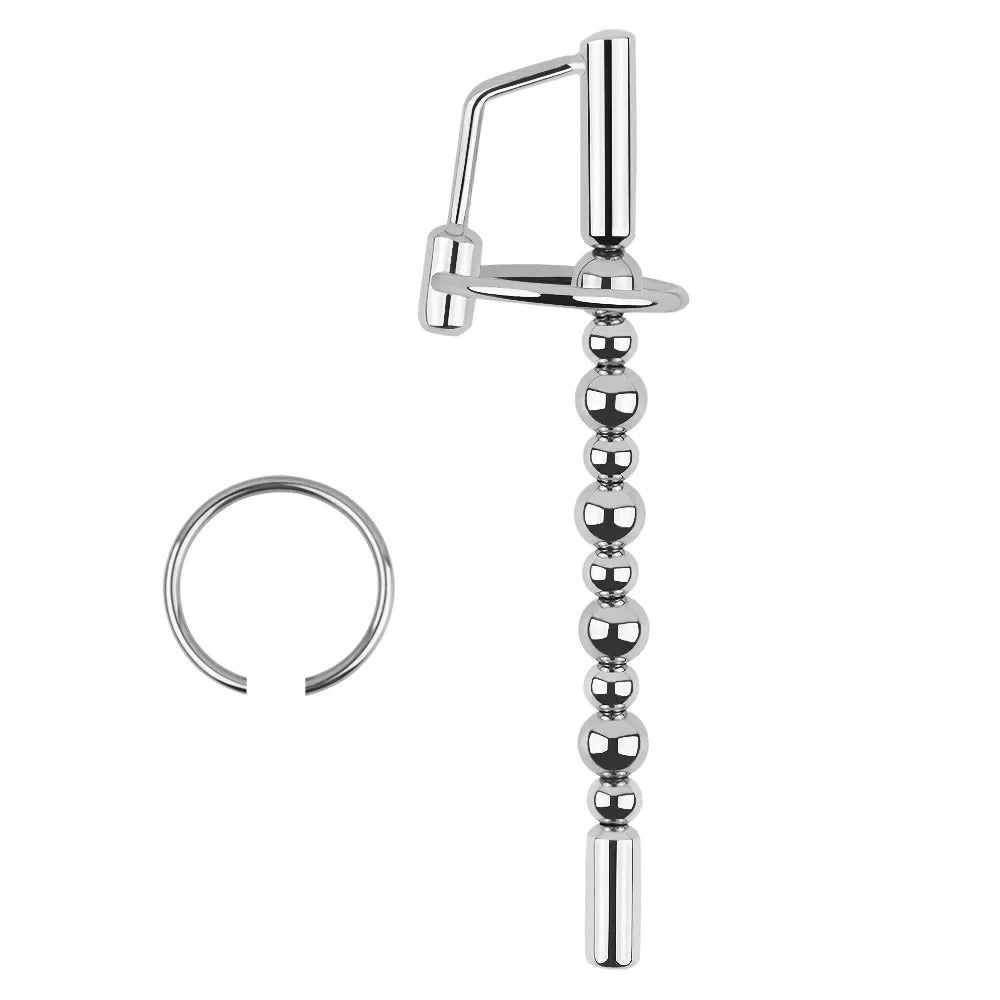Cock ring and locking/connector section detail on stainless steel beaded urethral sound chastity device