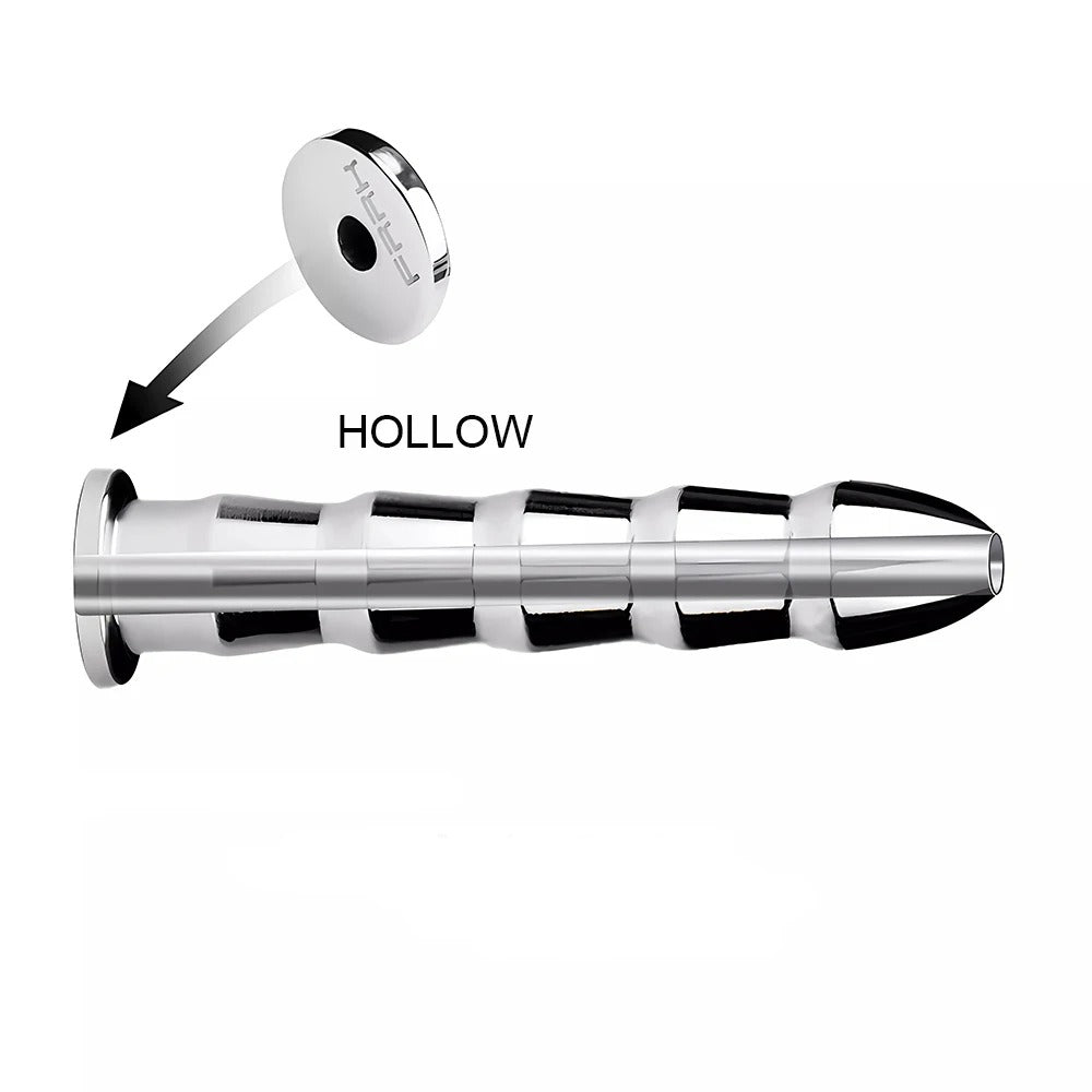 Hollow channel detail on stainless steel urethral plug, showing the open tube design and polished edges