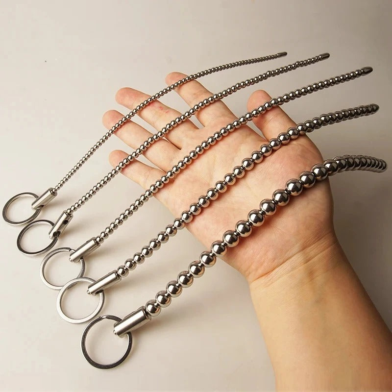 Long stainless steel male urethral beads dilator, straight beaded rod, front view
