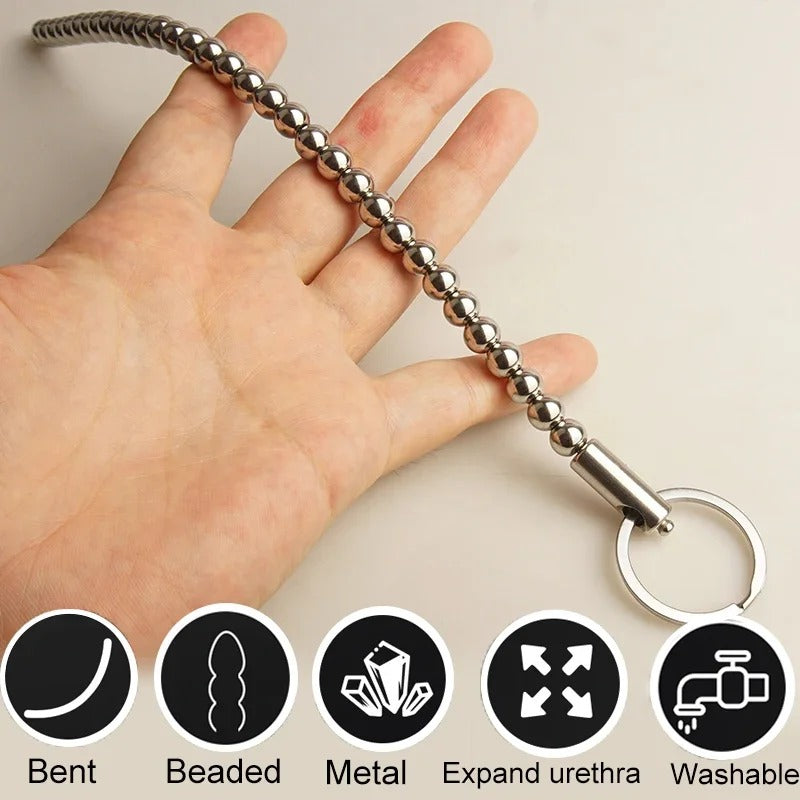Long stainless steel male urethral beads sounding toy shown full length for scale