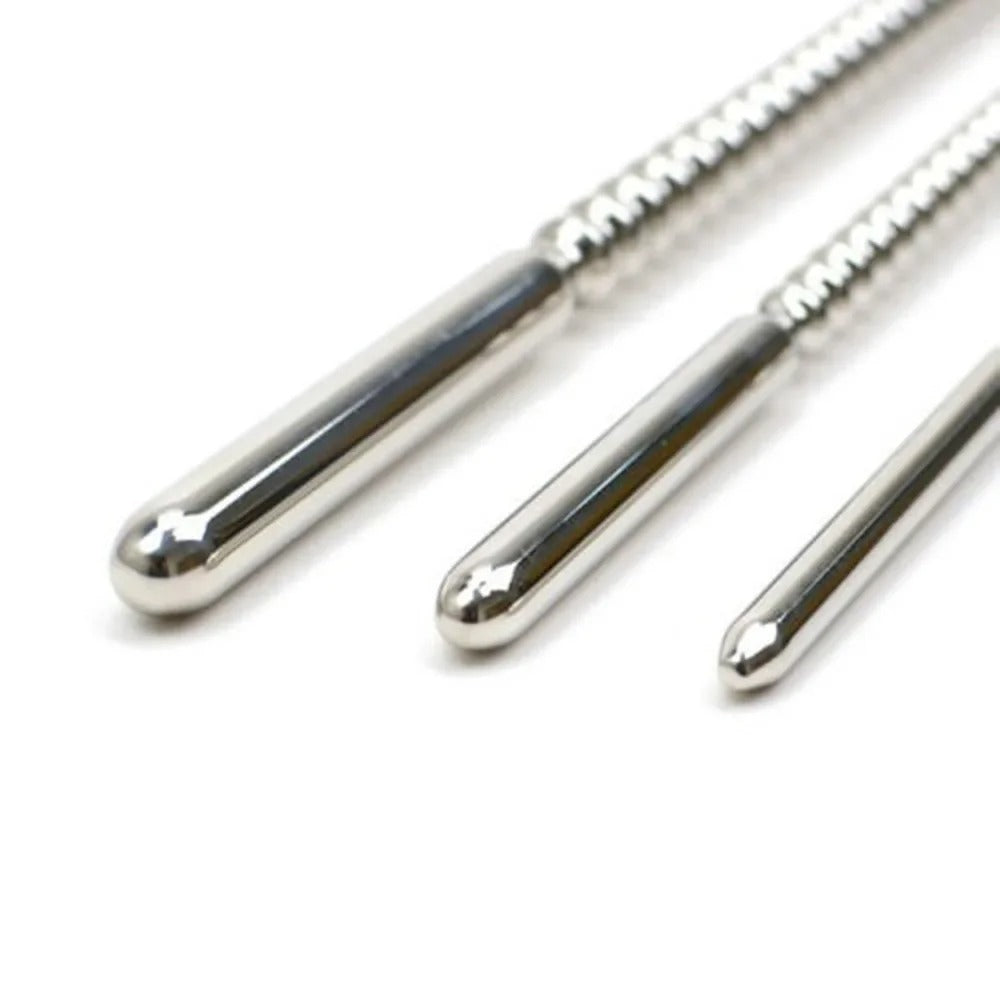 Rounded tip detail of polished stainless steel urethral dilator for controlled insertion and removal