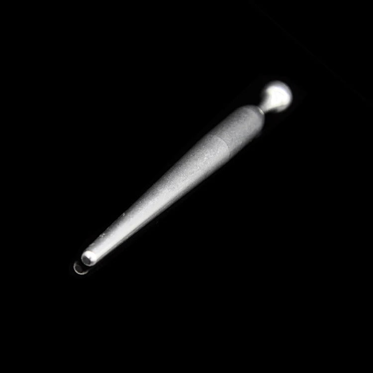 Polished non-porous stainless steel surface detail on men’s urethral sounding rod