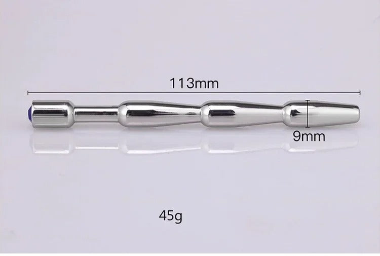 Smooth rounded head/tip detail on stainless steel urethral sound dilator designed for controlled insertion