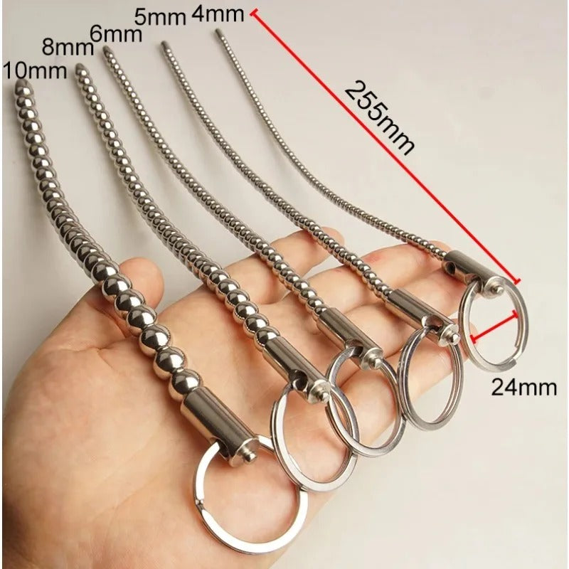  Beaded stainless steel urethral dilator, angled close-up showing smooth bead spacing