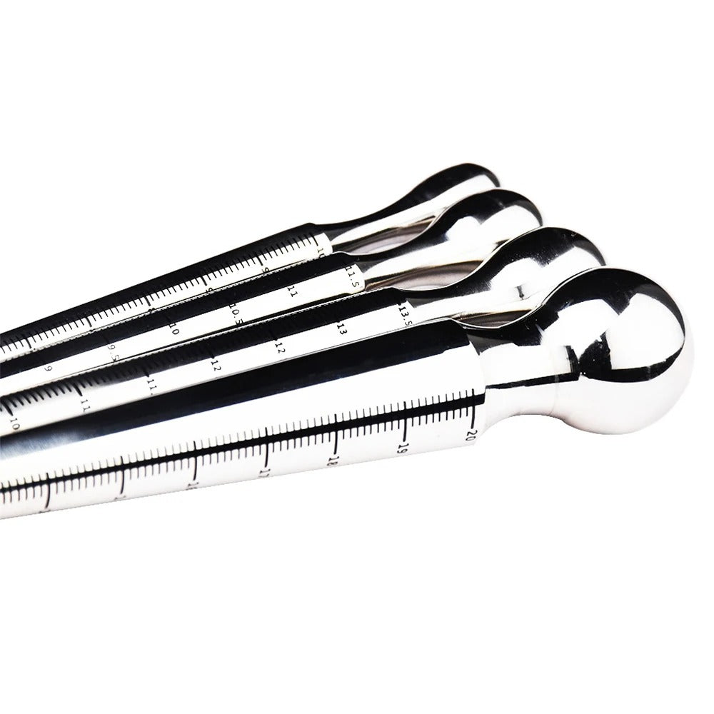 Smallest size stainless steel urethral plug from the 4-size set, scale markings visible