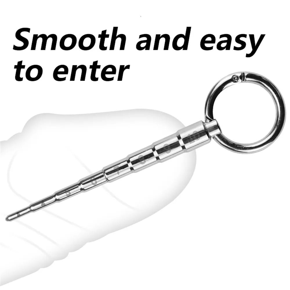 Tapered tip detail of men’s stainless steel urethral plug dilator for controlled insertion, scale visible along the shaft